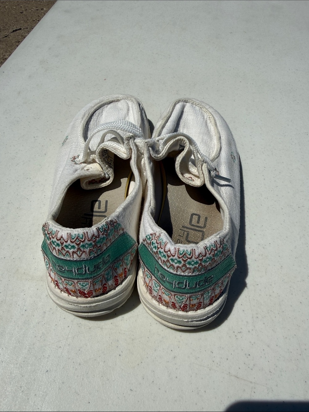 Hey Dude White Canvas Slip-On Shoes with Teal Embroidered Accent